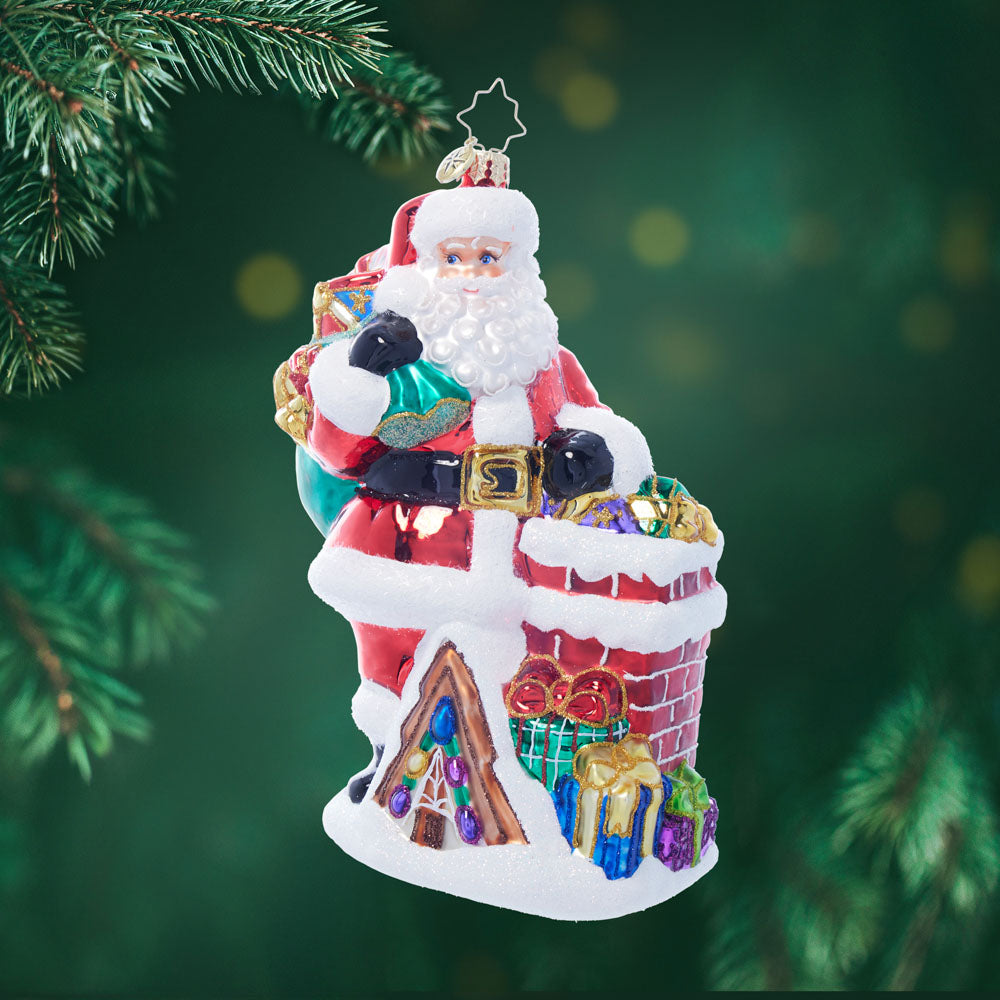 Down the Chimney St. Nick ceramic ornament shaped like a chimney with red brick pattern and white snow details.