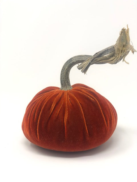 Handmade orange velvet pumpkin with a natural stem.