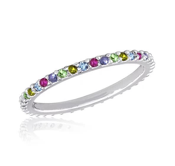 Thin multi-diamond stack ring featuring a slender band with multiple small diamonds set in a continuous line.
