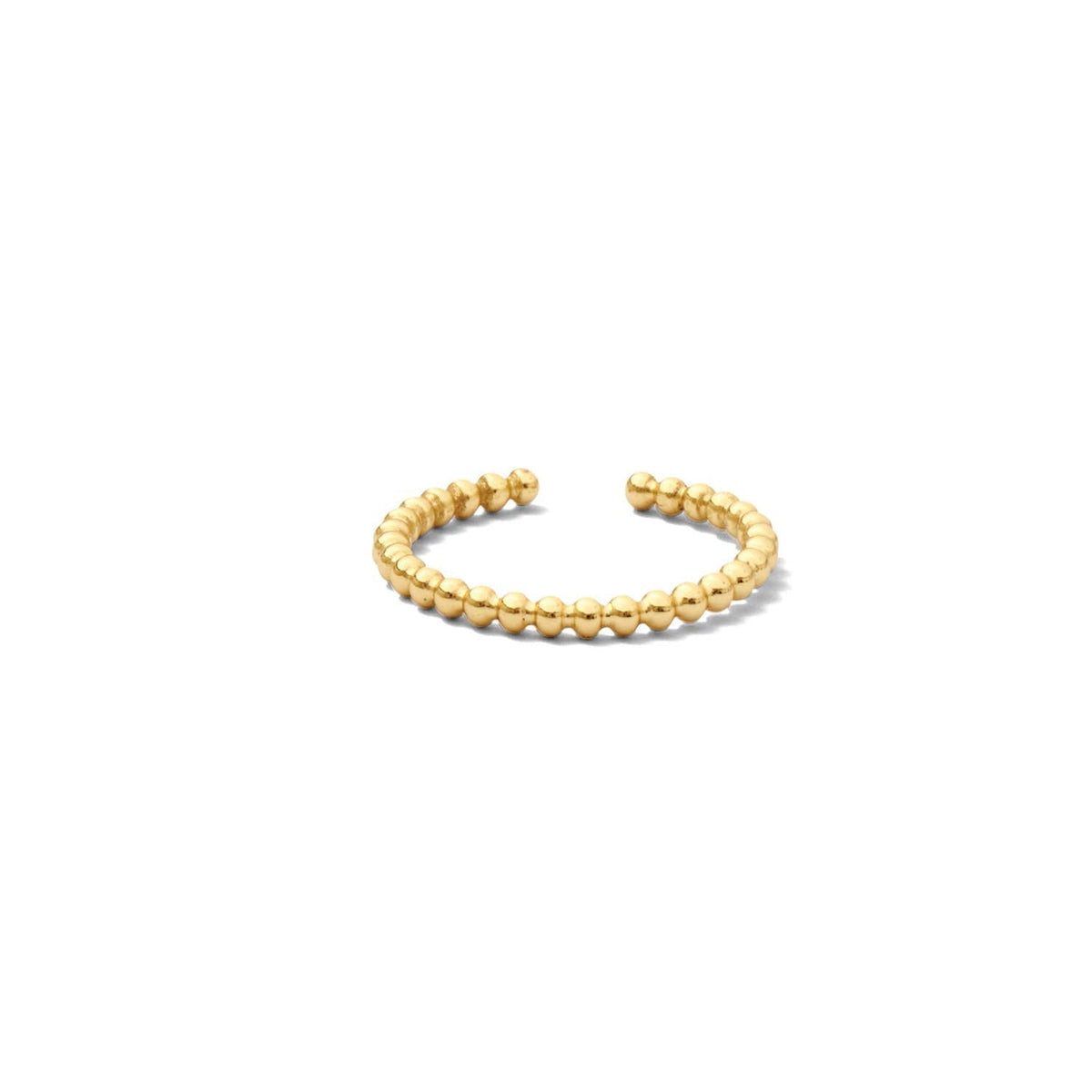 Adjustable dot ring in rhodium-plated brass with a delicate band silhouette.