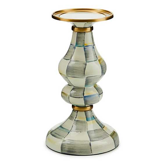 Mackenzie Childs hand-painted check pillar candlestick with brass accents and a bronzed rim.