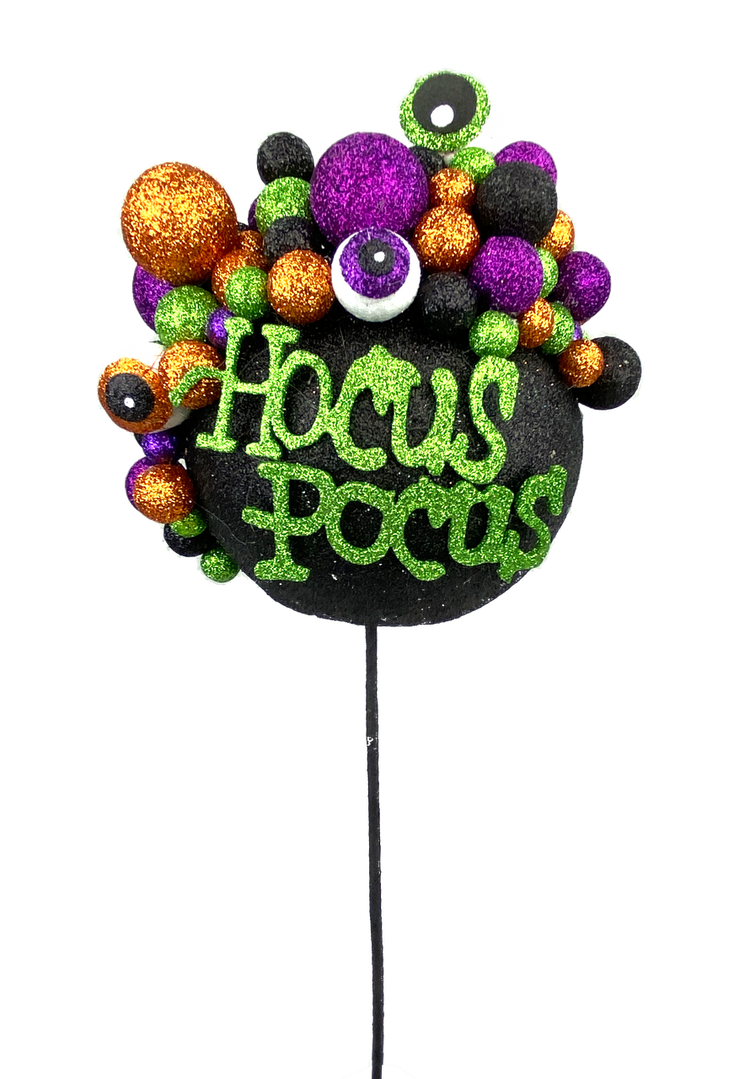 Black cauldron-shaped Halloween pick with a bubbling liquid detail.