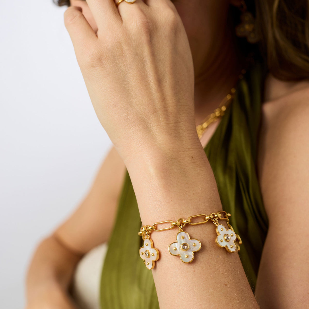 Colette charm bracelet in gold plate with mother-of-pearl accents and a toggle clasp.
