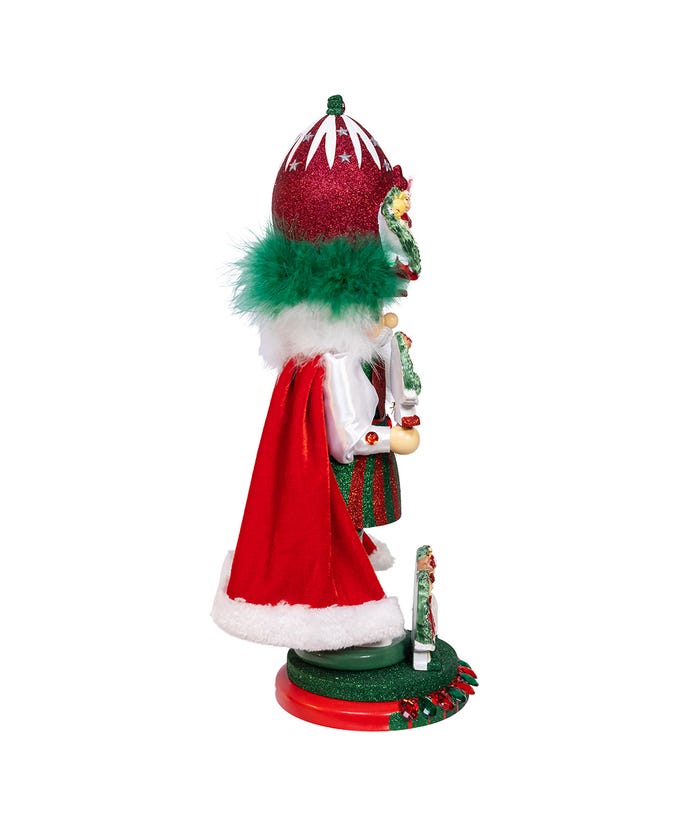 Side view of an 18-inch Hollywood Nine Ladies Dancing Nutcracker with a red cape and green fur trim.