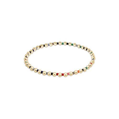Hope Grateful bracelet featuring mixed 2mm seed beads in spring colors with gold-filled accents on elastic cord.