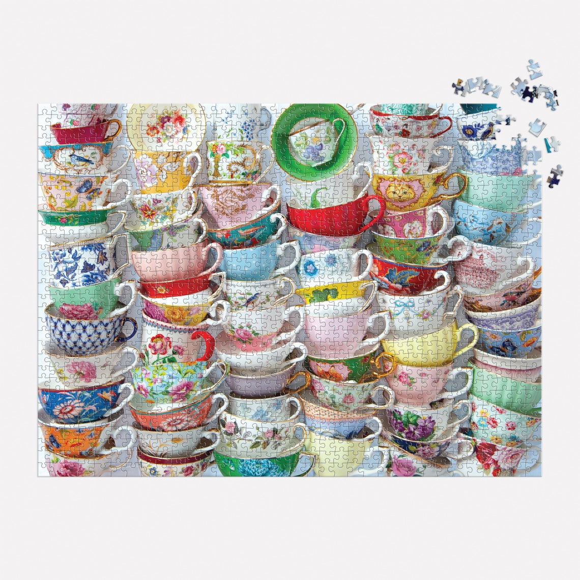 Teacups puzzle box featuring a colorful vintage illustration of teapots and cups on its front cover.
