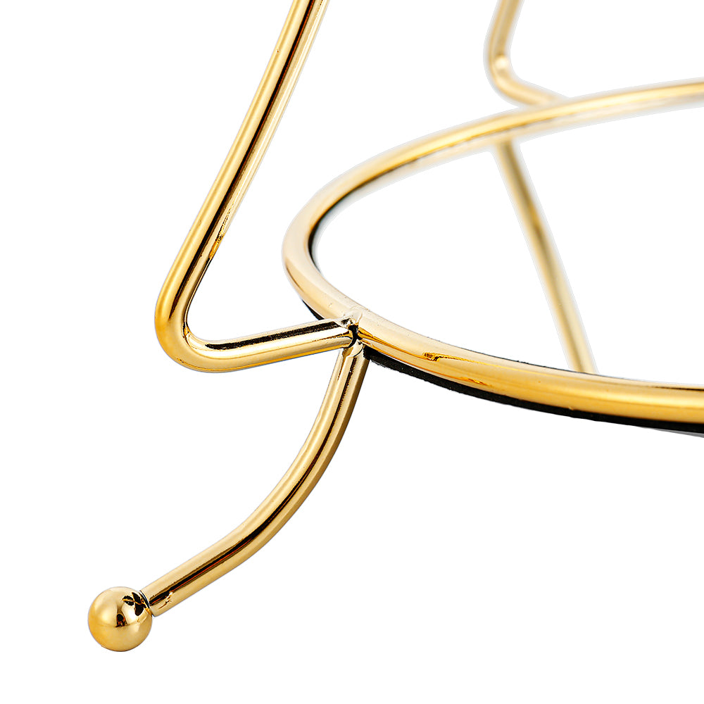 Gold tiered tree-shaped accessory stand with three levels holding decorative items.