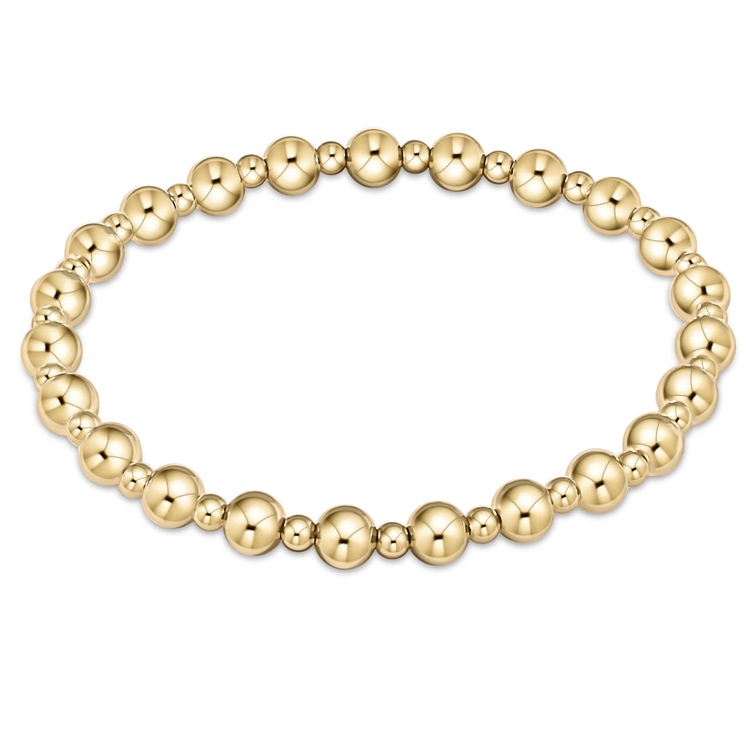 Extends Classic Grateful 5mm and 3mm 14kt gold-filled bead stretch bracelet.