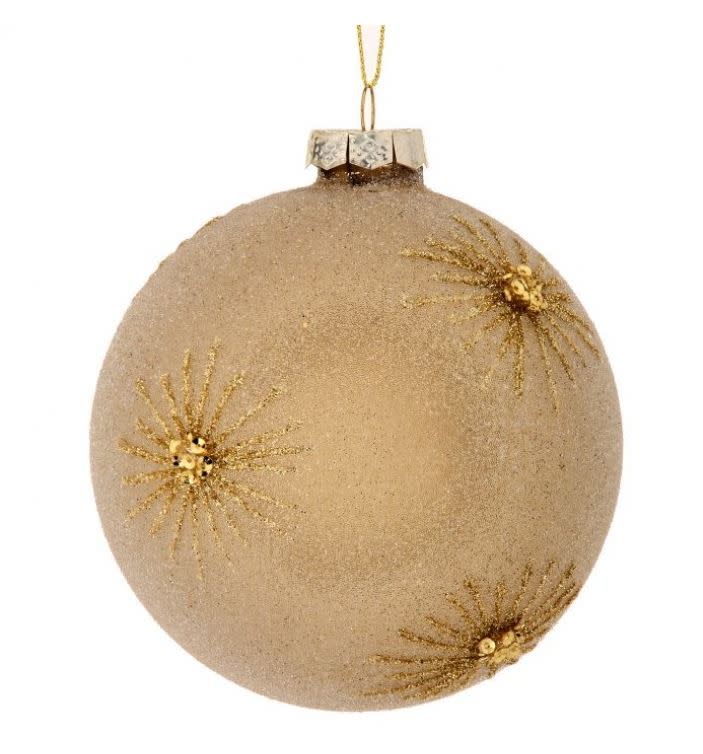 4-inch glass ball ornament with a frosted beige finish and gold beaded starburst designs.