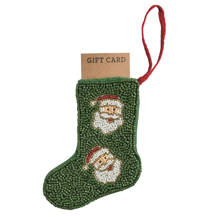 Green beaded stocking ornament with Santa faces and a red loop hanger holding a gift card.
