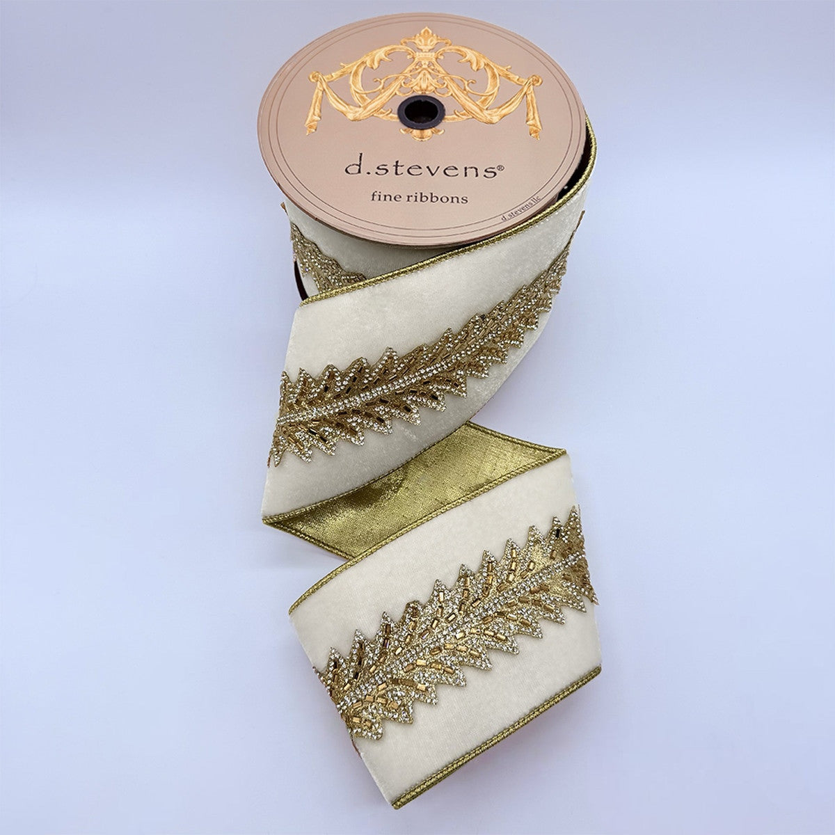 4-inch winter white velvet ribbon with gold jewel Art Deco center trim on a spool.