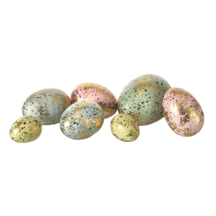 Set of metal leaf Easter eggs in mesh bags with dark speckled wild bird egg pattern.