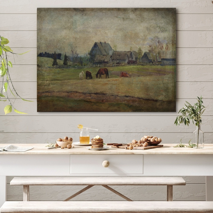 Evening On the Homestead Farm Landscape Canvas Wall Art hanging above a white wooden table.