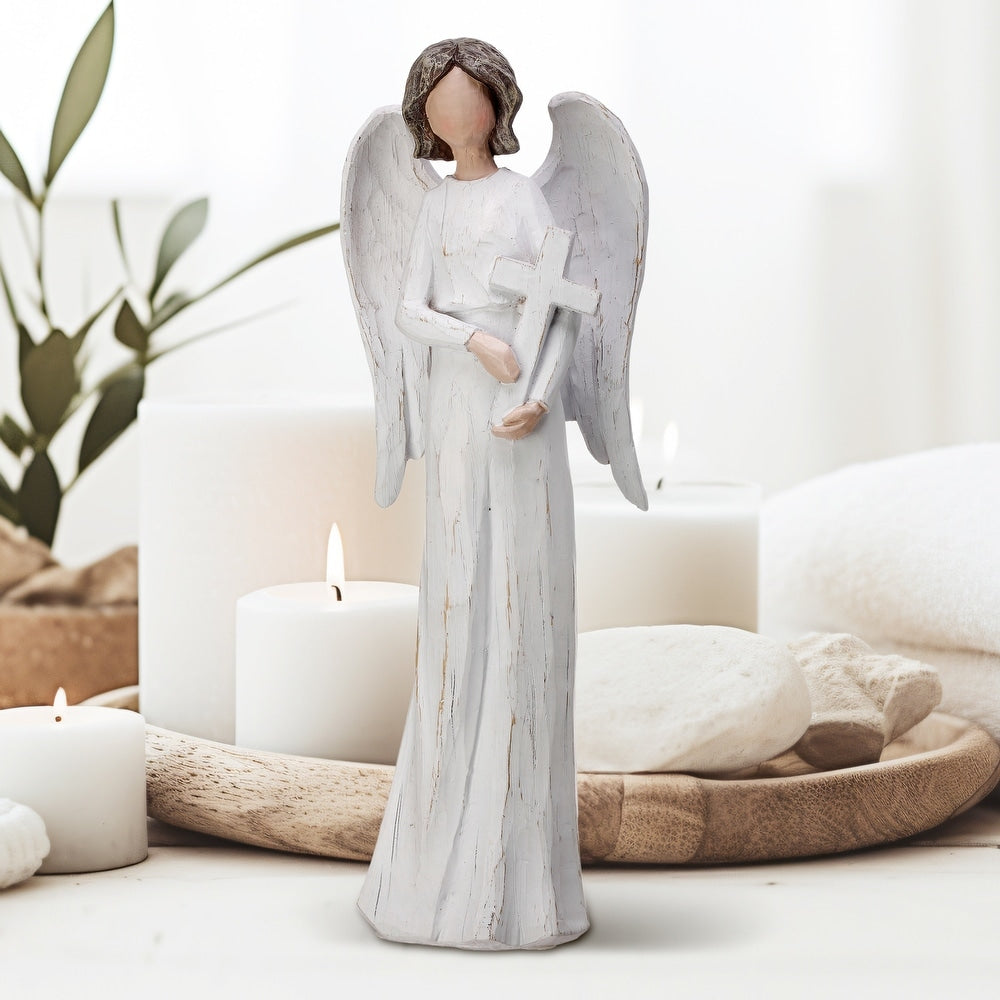 White resin angel figurine with brown distressing holding a cross