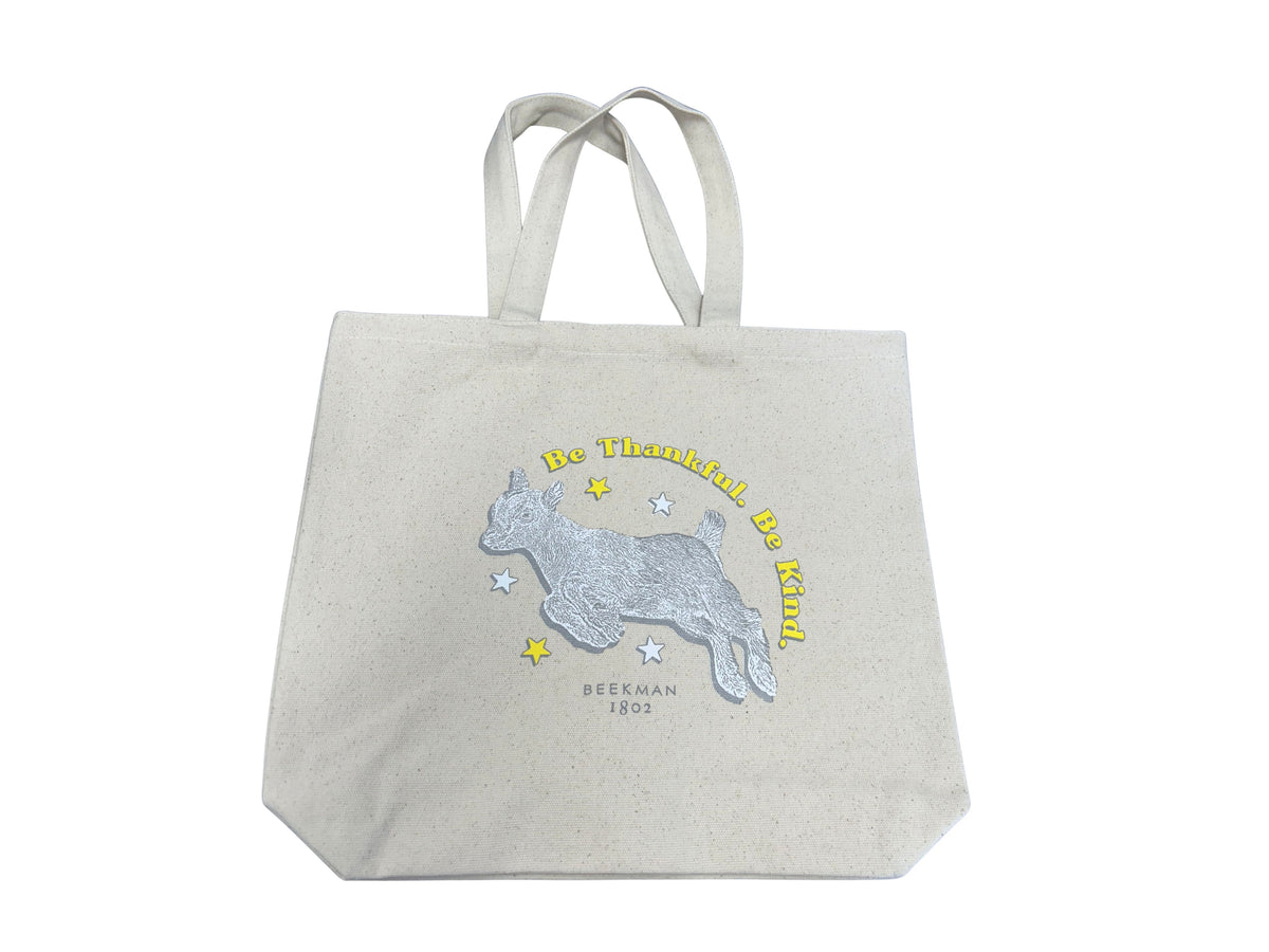 Canvas tote bag with a jumping goat illustration and the text "Be Thankful. Be Kind."