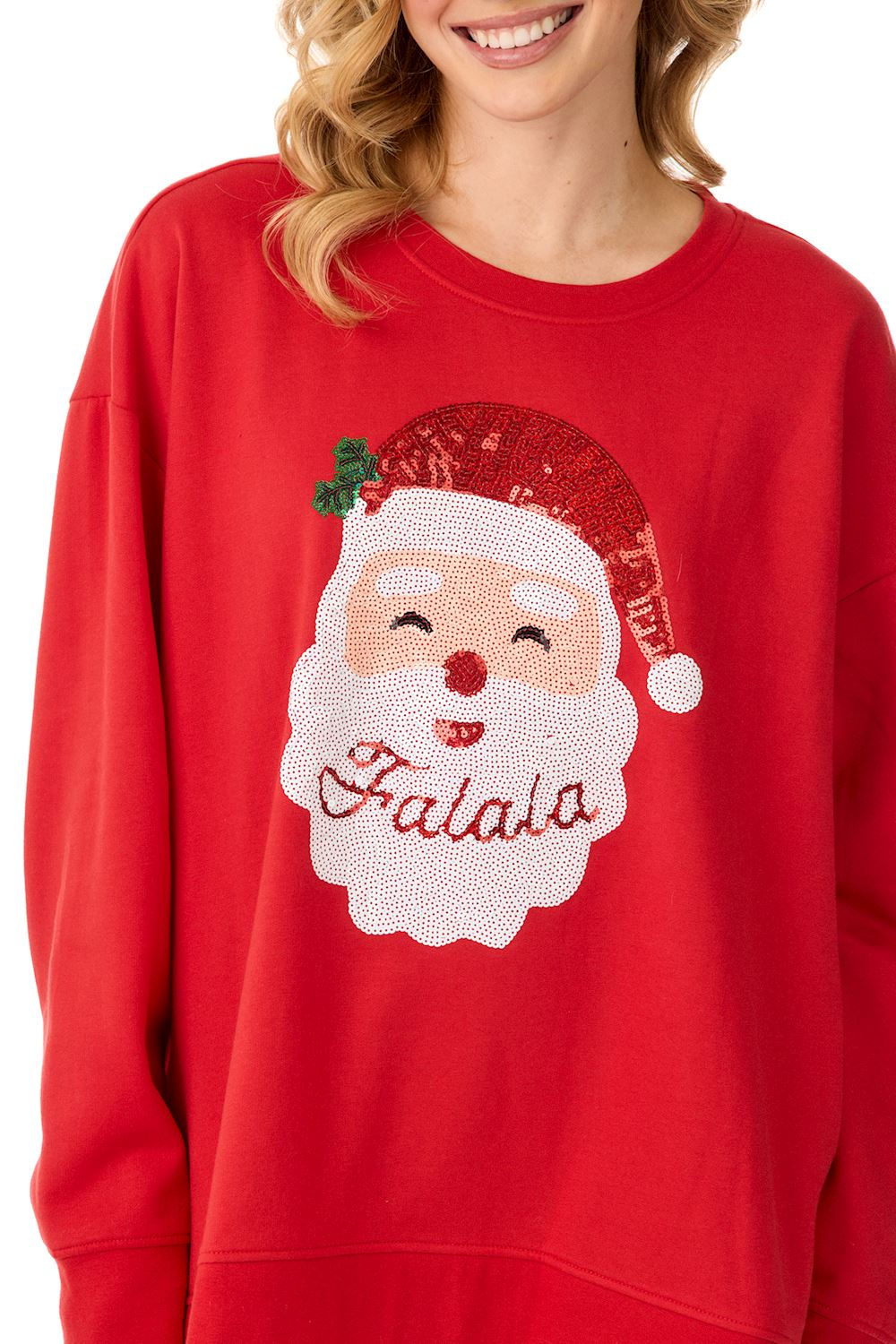 Woman wearing a red Santa Sparkle Sweatshirt with a sequined Santa face and 'Falala' text.
