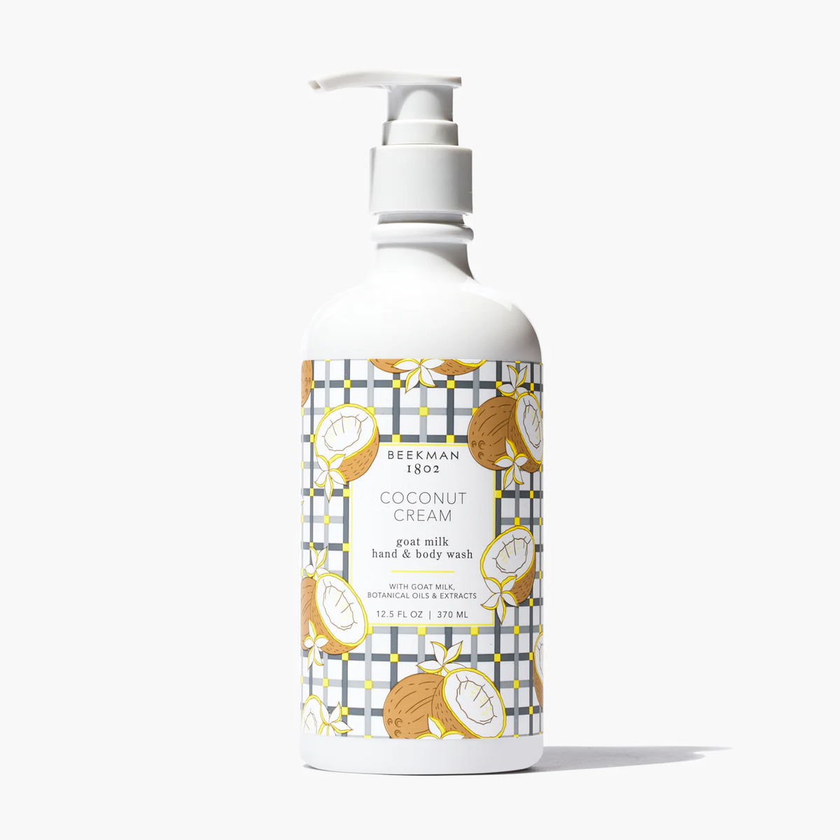 Beekman 1802 Coconut Cream goat milk hand and body wash in a 12.5 fl oz white pump bottle.