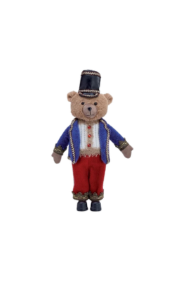 Teddy bear nutcracker figure wearing a blue jacket, red pants, and a black hat.