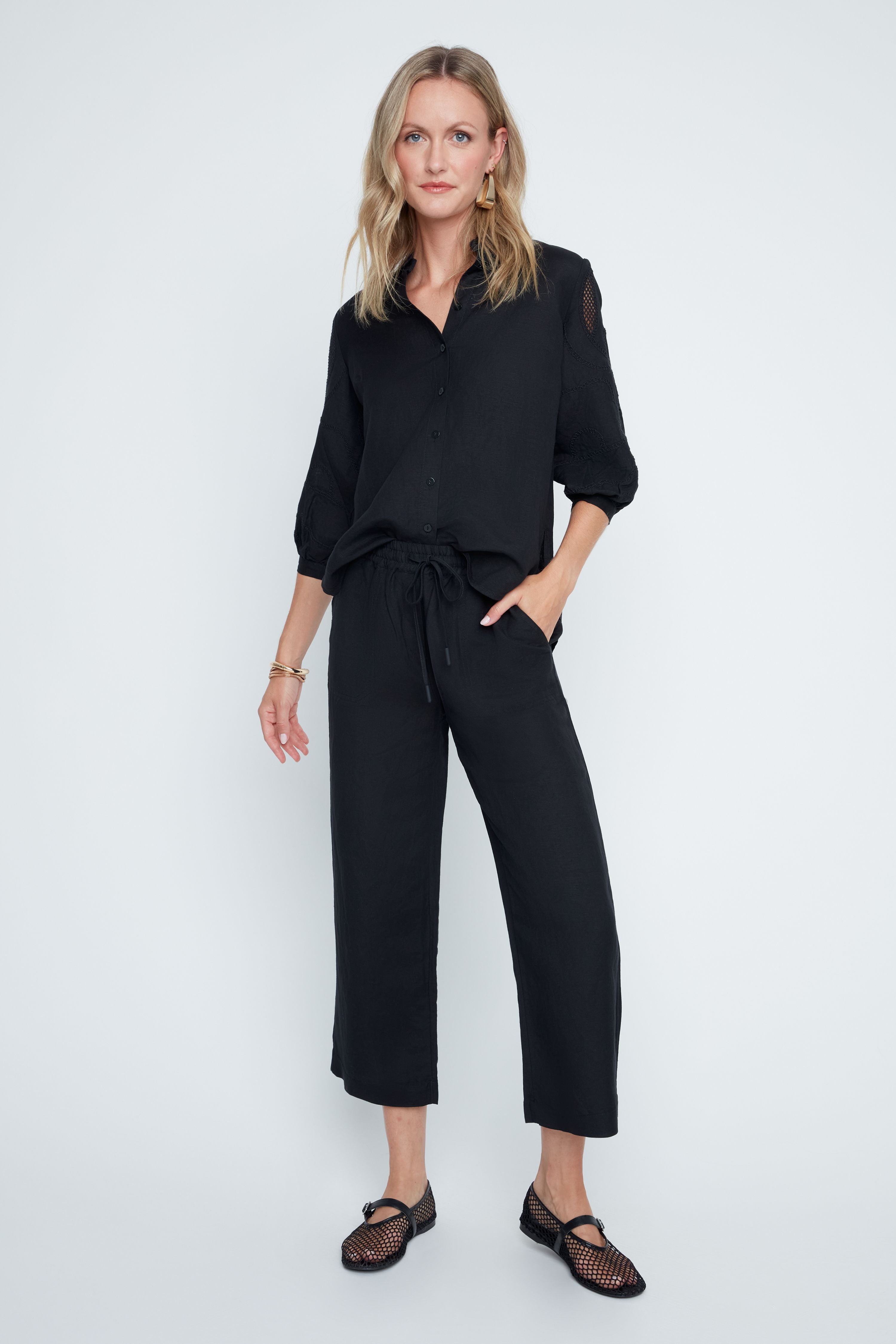 Relaxed-fit Victoria woven pants in neutral tone with elastic waistband, drawstring, and side pockets.