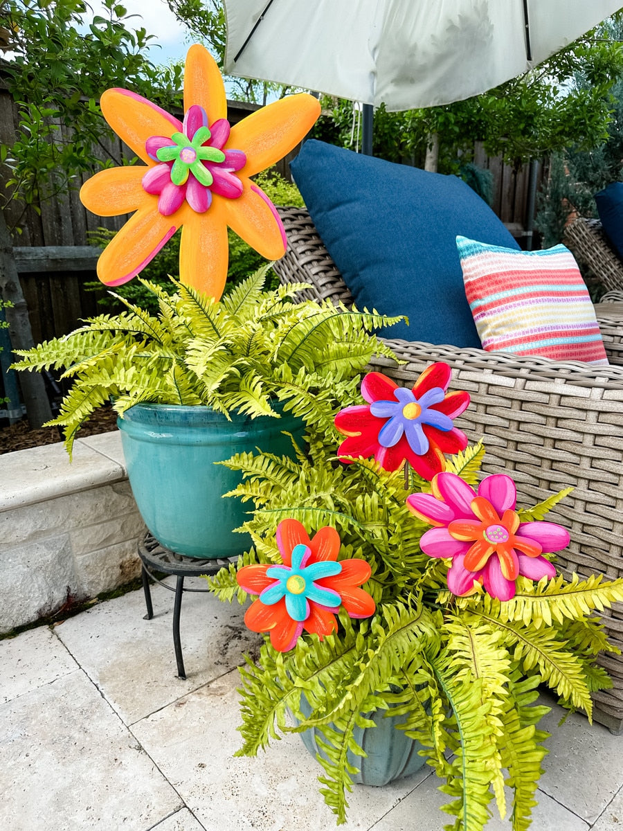 Enchanted Flower Large decorative stake featuring a large floral silhouette with intricate petal patterns in natural tones.