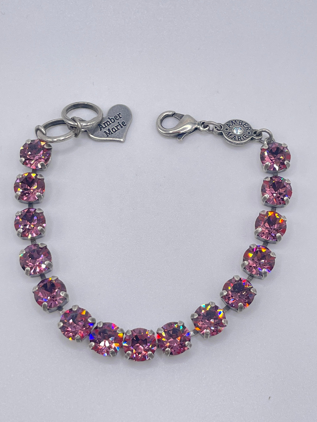 Amber Marie bracelet with pink round-cut crystals in a silver-tone setting and heart charm.
