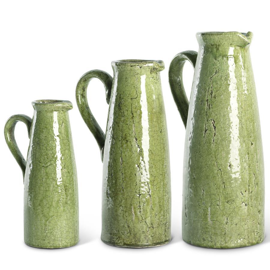 Terracotta green ceramic pitcher with a crackled glaze finish.