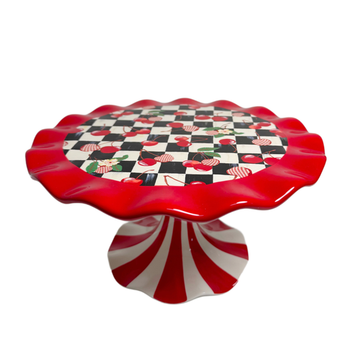Mon Cheri Pedestal Platter with a red ruffled edge, cherry checkerboard top, and striped base.