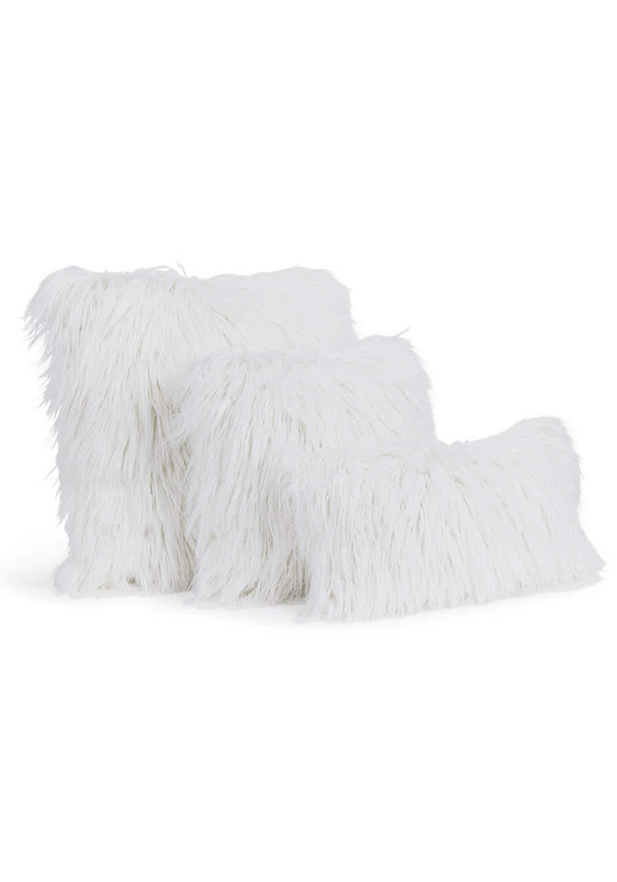 Three white Tibetan lamb faux fur pillows in varying sizes stacked against a white background.