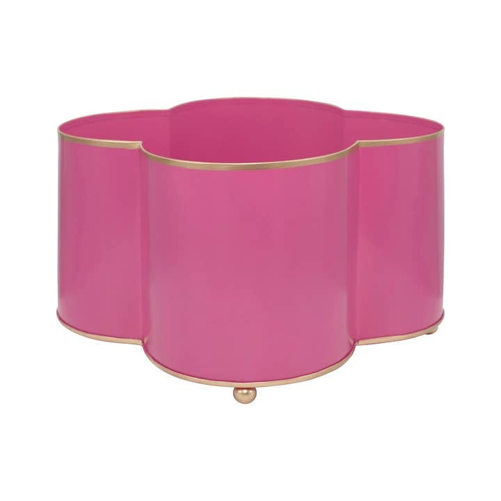Mattie quatrefoil cachepot planter with gold trim feet in a rounded shape holding four small pots.