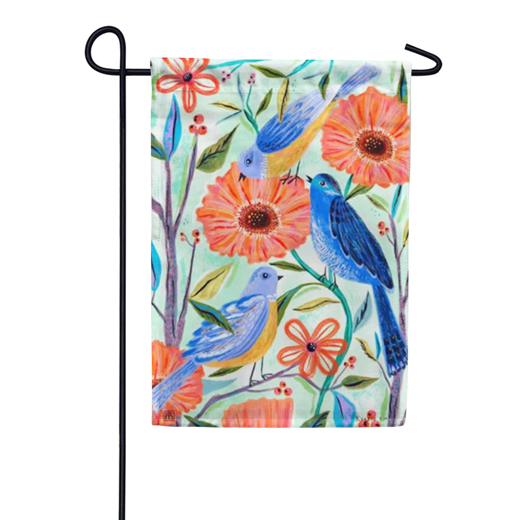 Garden flag with a watercolor-style pattern of blue birds and orange flowers on a light green background.