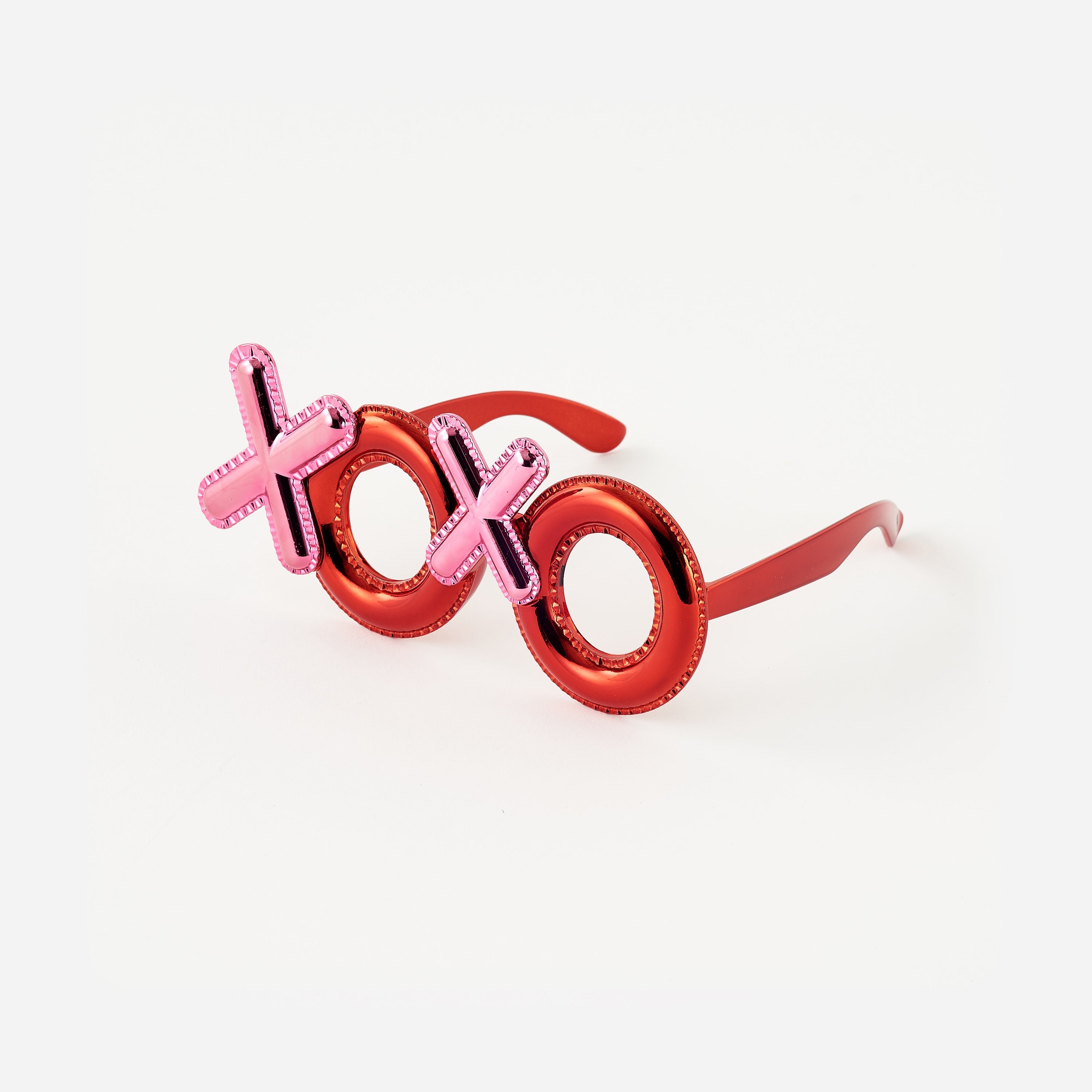 XOXO PVC sunglasses with a black frame featuring heart-shaped lenses.