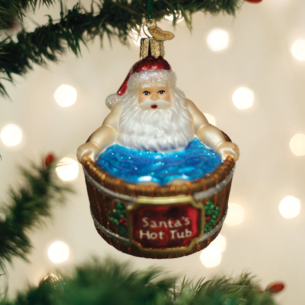 Glass Santa's Hot Tub Christmas ornament featuring Santa relaxing in a blue glittery tub.