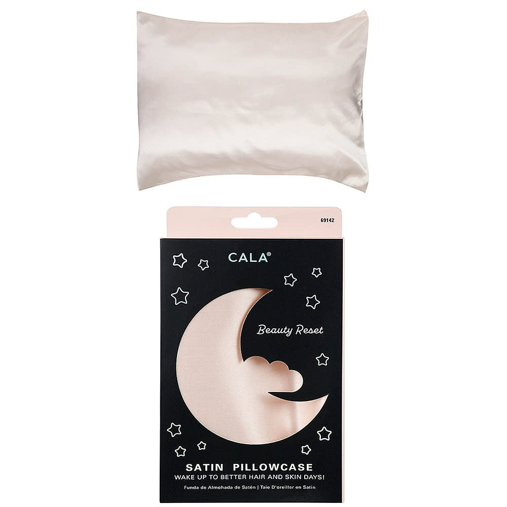 Ivory satin pillowcase with smooth texture designed to reduce hair frizz.