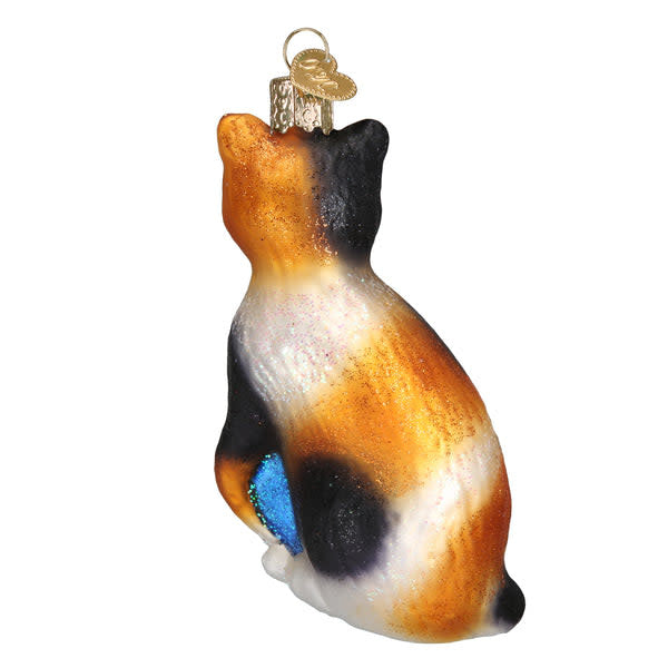 Glass ornament shaped like a calico cat with white, orange, and black fur patterns.