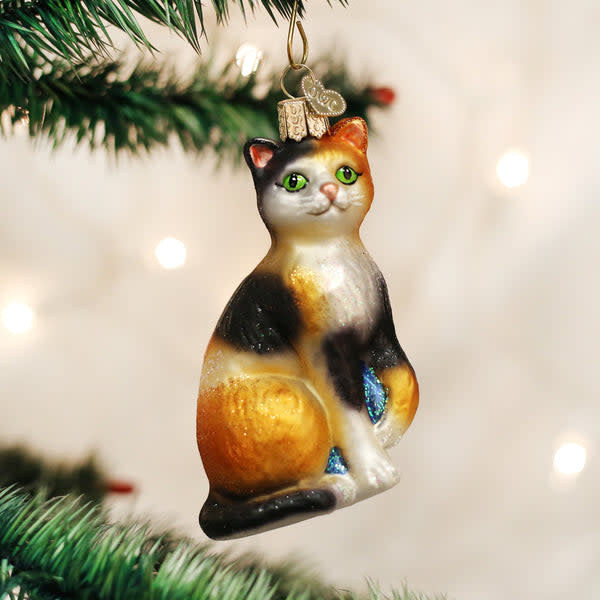 Glass ornament shaped like a calico cat with multicolored fur pattern.