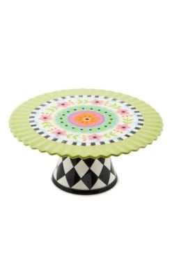 Calico pedestal platter made from dolomite ceramic with a speckled pattern and raised rim.