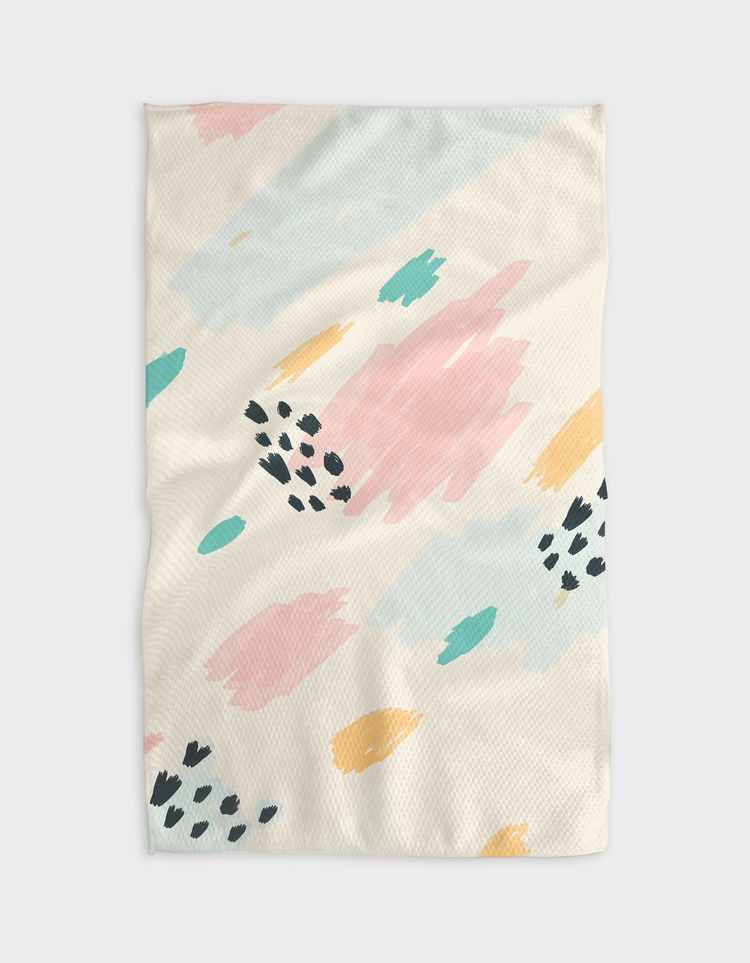 Waffle weave kitchen tea towel in candy pink with a geometric pattern print.