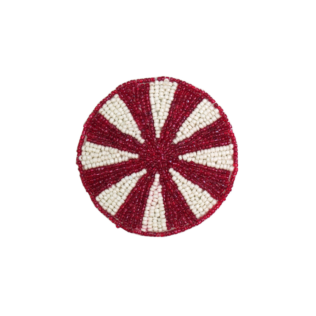 Set of four round coasters with candy-themed beaded patterns in pastel colors.