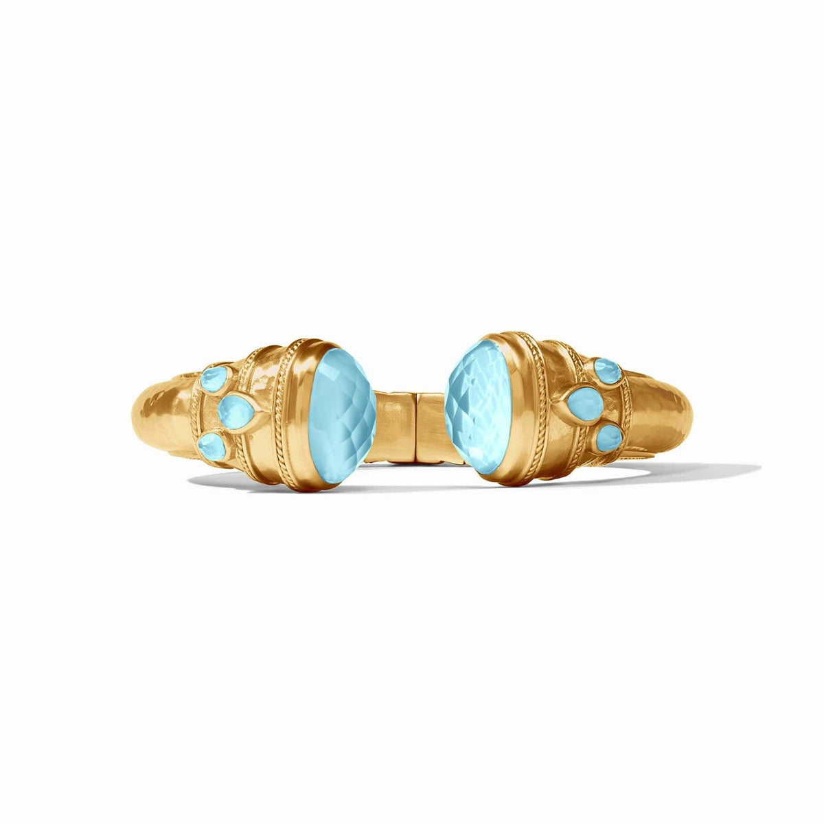 Gold cuff bracelet with rose-cut endcaps, pear gemstones, freshwater pearl, and mother-of-pearl inlays.