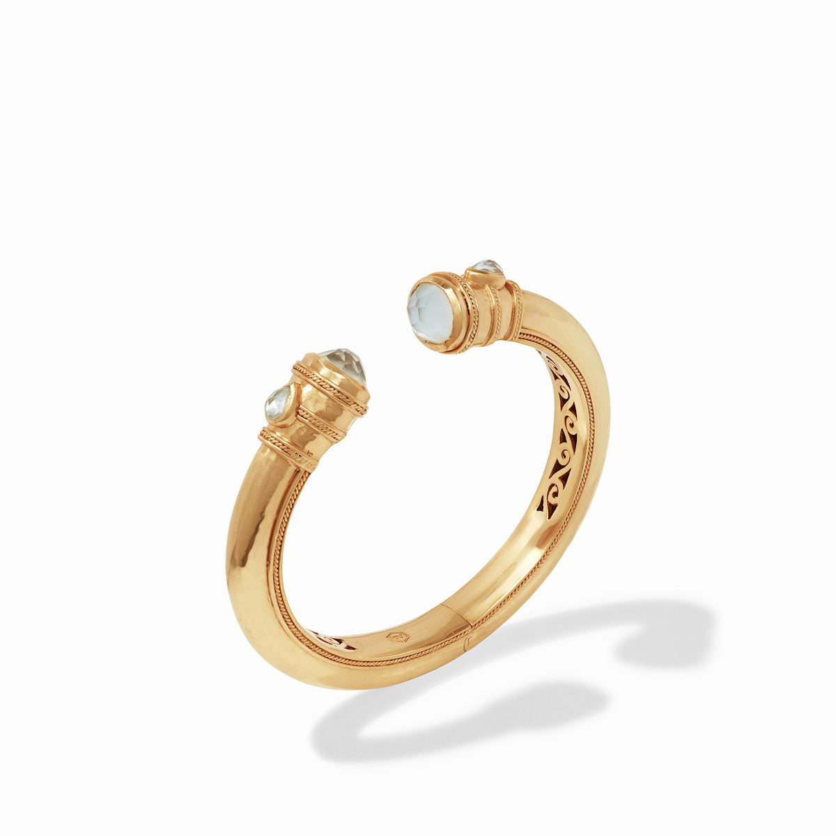 Cannes Demi Cuff bracelet with gilded shank, shell pearl endcaps, and pear-shaped gemstones.