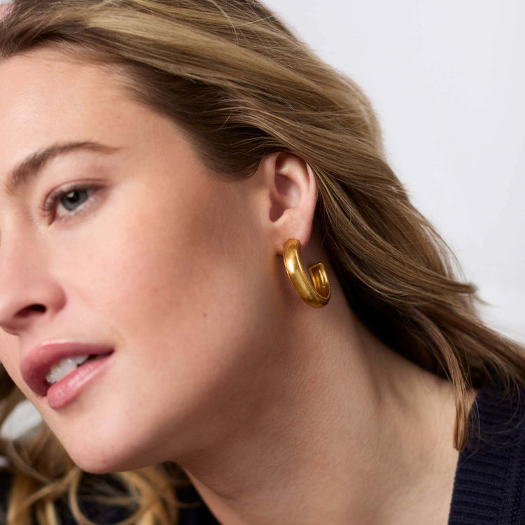Gold-plated hoop earring with a sleek circular silhouette