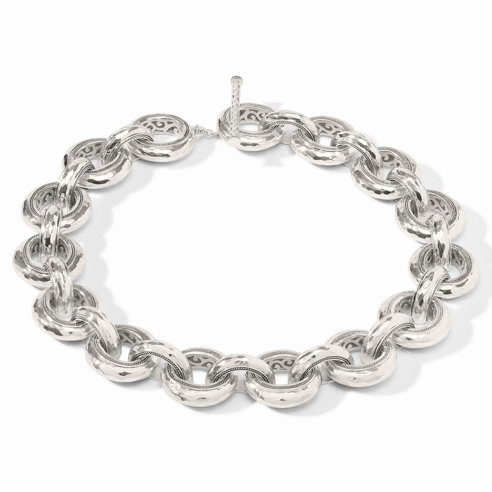 Silver hammered link necklace with a pierced inner design on a toggle clasp