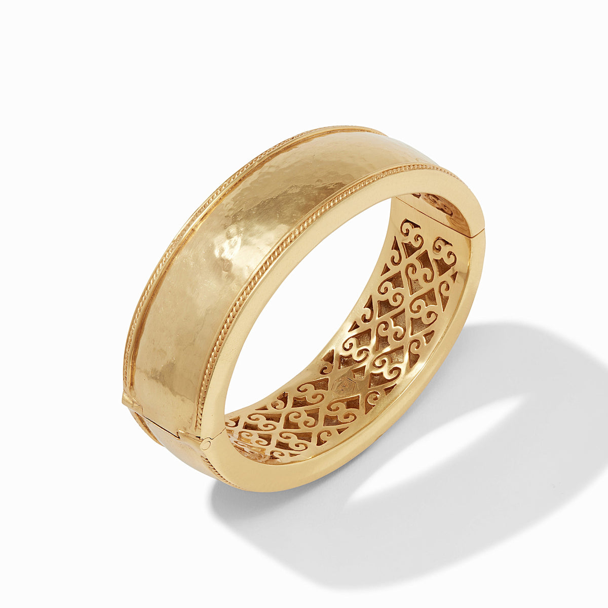 Wide gold-plated bangle with twisted wire hinge detail