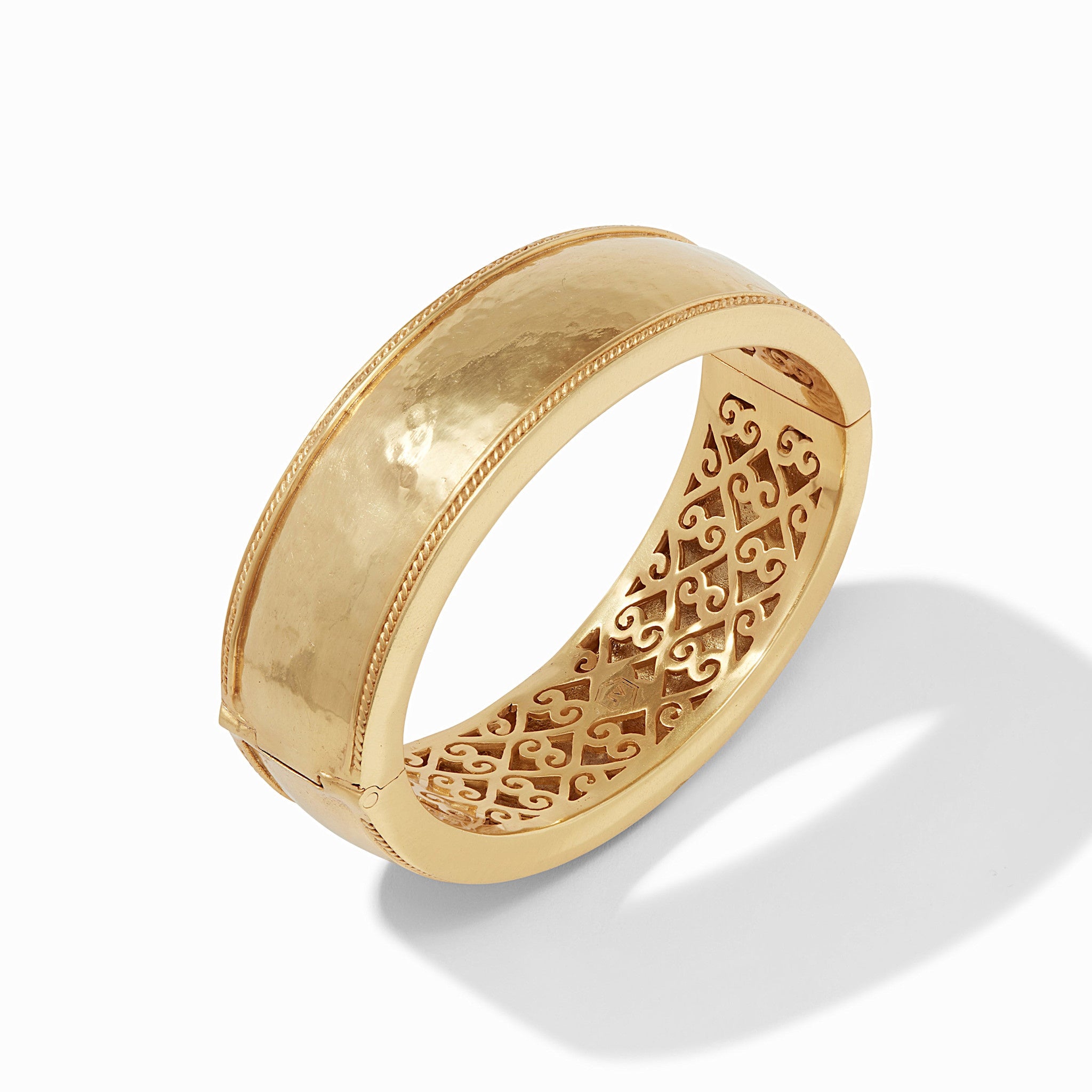 Wide gold-plated bangle with twisted wire hinge detail