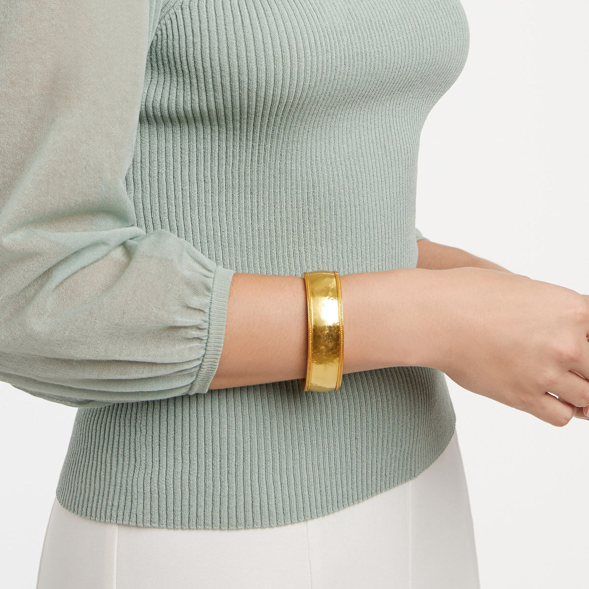 Wide gold-plated bangle with twisted wire hinge detail