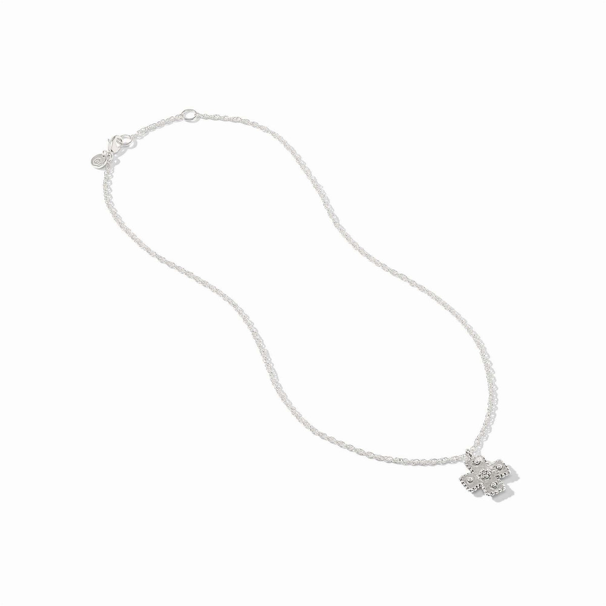 Silver Canterbury necklace with hand-hammered cross pendant featuring bead accents on a delicate chain.