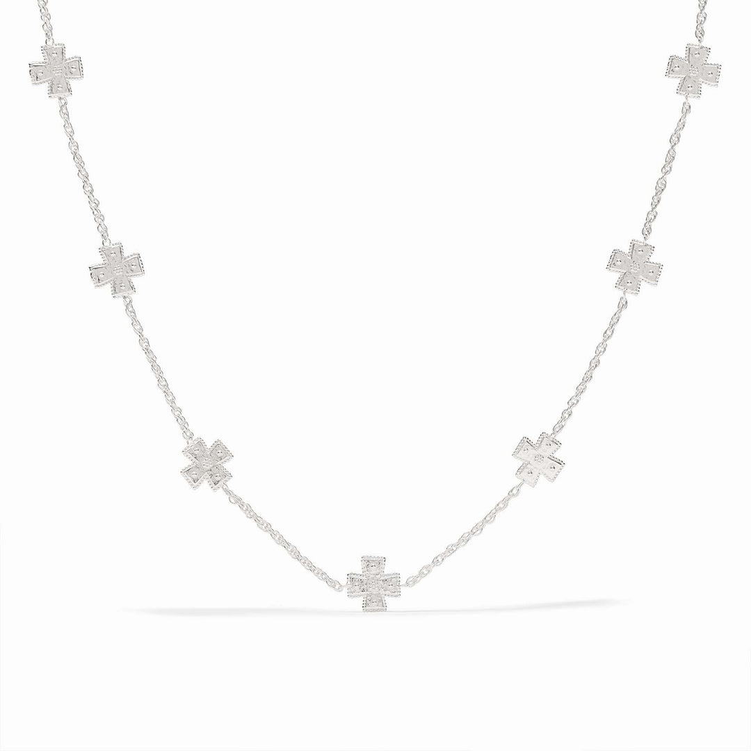 Silver station necklace with hand-hammered cross pendants on a delicate rope chain