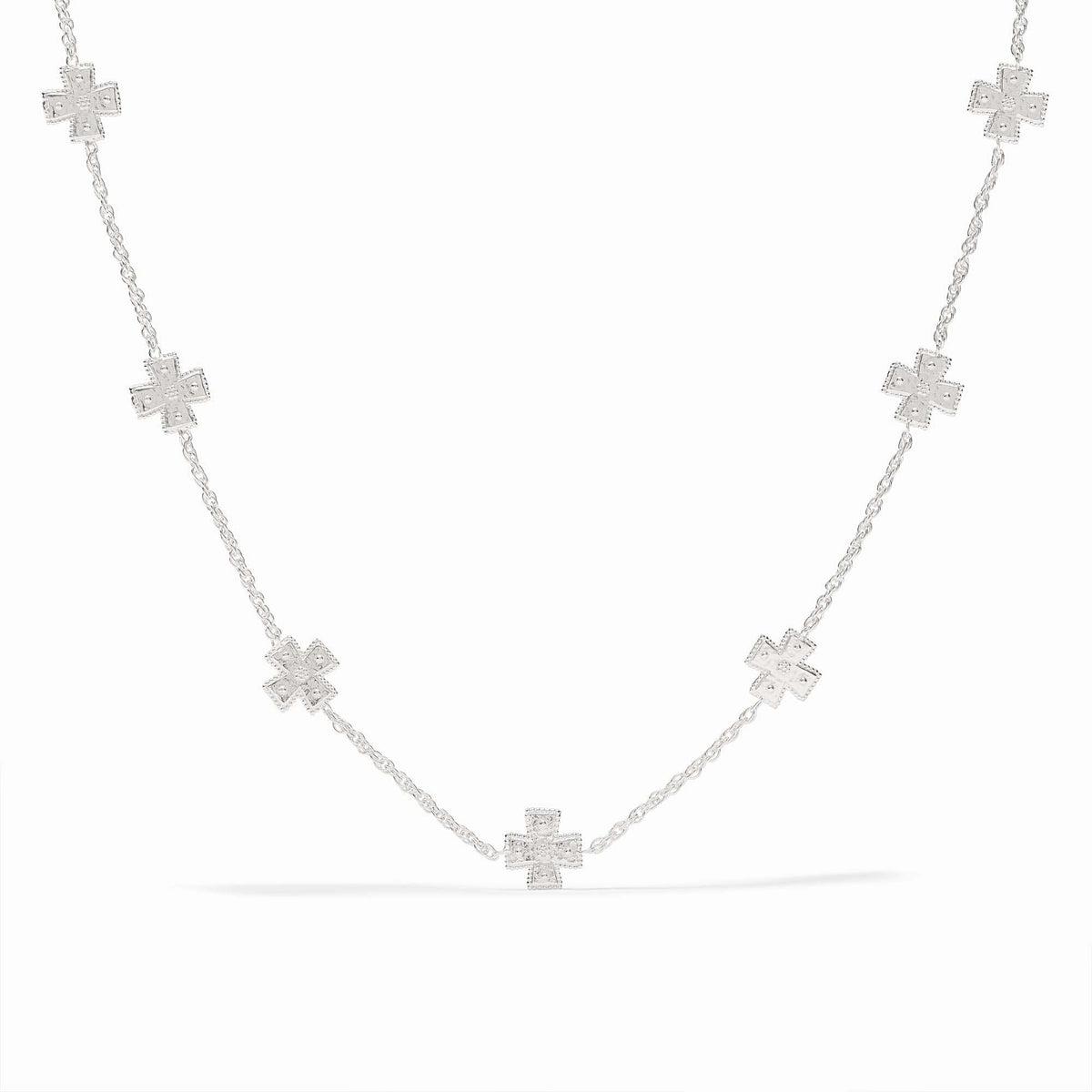 Silver station necklace with hand-hammered cross pendants on a delicate rope chain