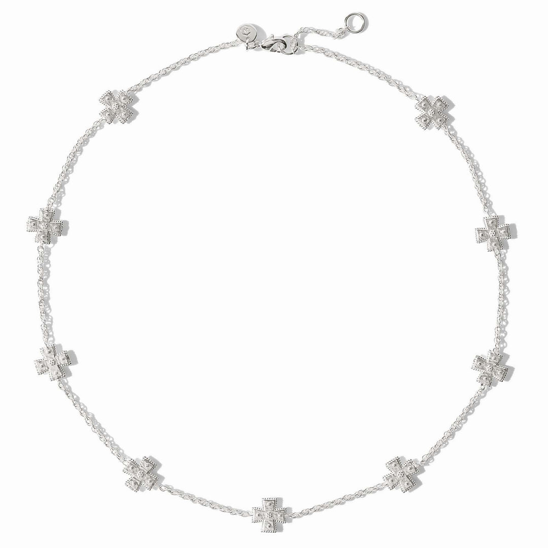 Silver station necklace with hand-hammered cross pendants on a delicate rope chain
