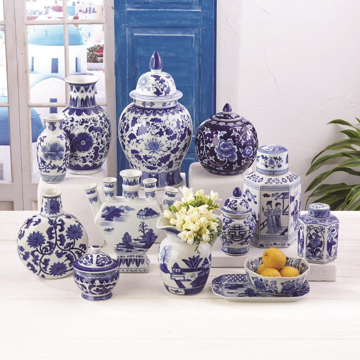 Blue and white ceramic home decor item in traditional shape with classic Canton pattern.